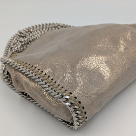 Falabella Tiny doré pailleté vue d'ensemble sac posé