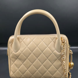 Dos du sac Chanel vintage beige, matelassage et anse ronde
