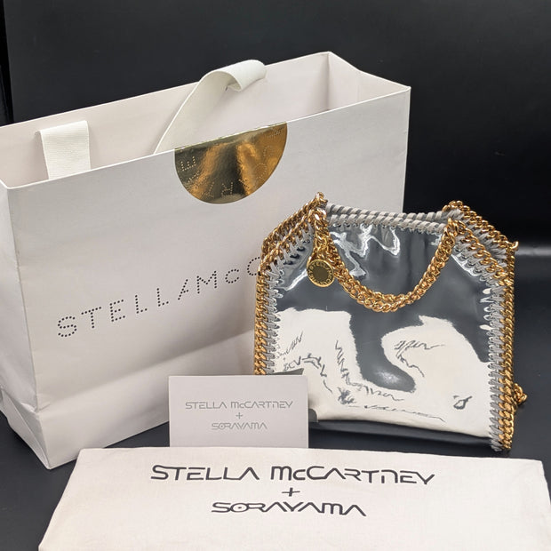 Sac Stella McCartney x Sorayama Falabella tiny argenté avec son sac de boutique, son dust bag et sa carte de boutique